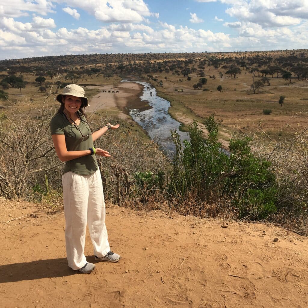 Sarah Shoemaker in front of a river in Africa