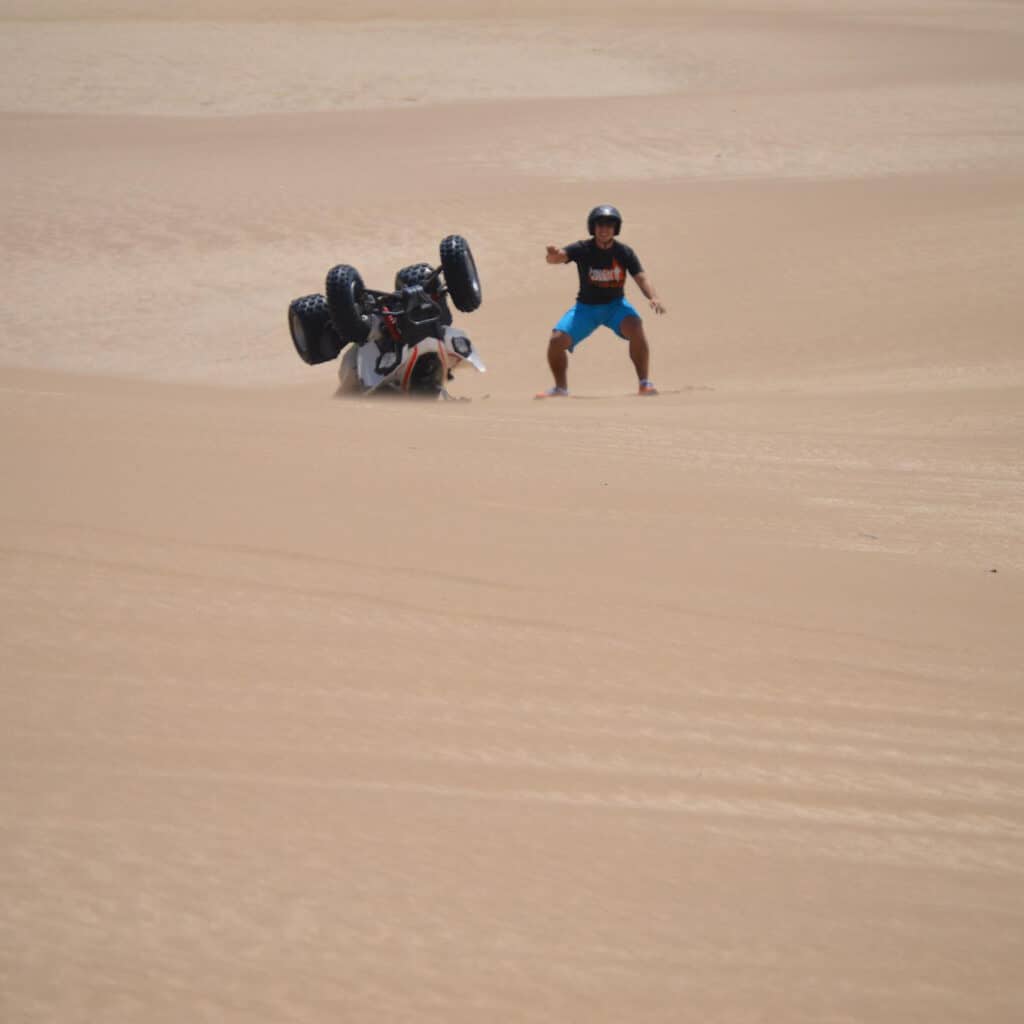 Sebastian Altomarino next to flipped over quad