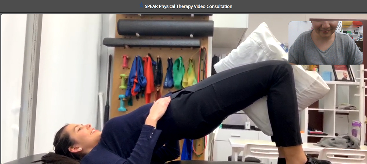 Woman exercising in Physical Therapy Video consultation