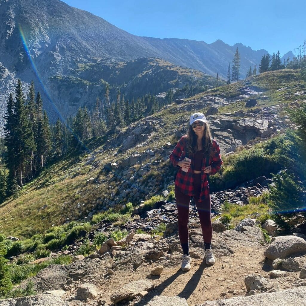 Angela Koziarz hiking a mountain