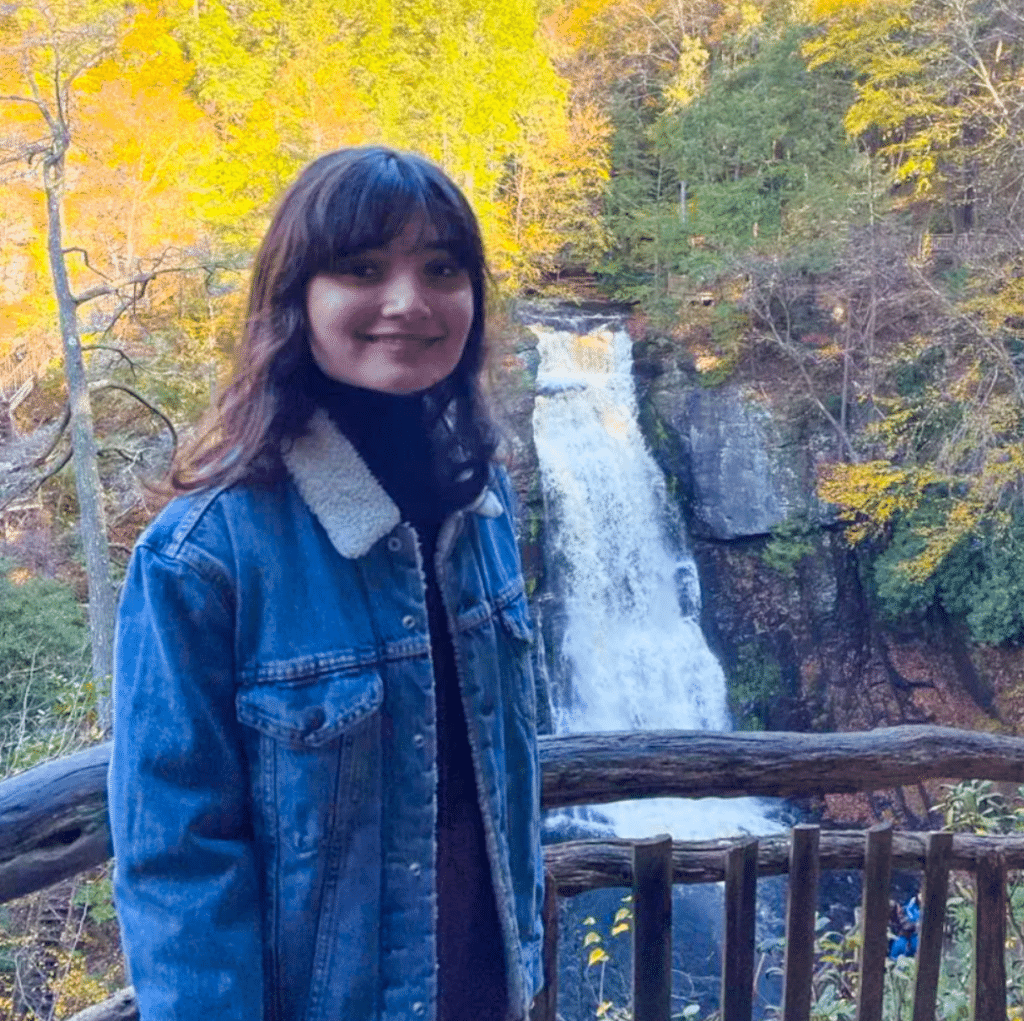 Sejal Kadam portrait in front of waterfall