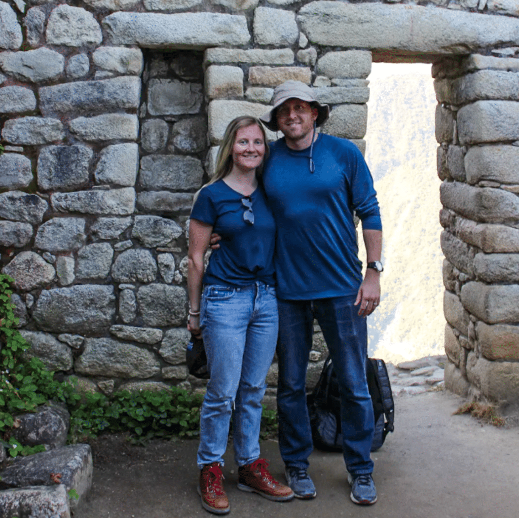 Zach Cogavin with friend in front of an ancient wall