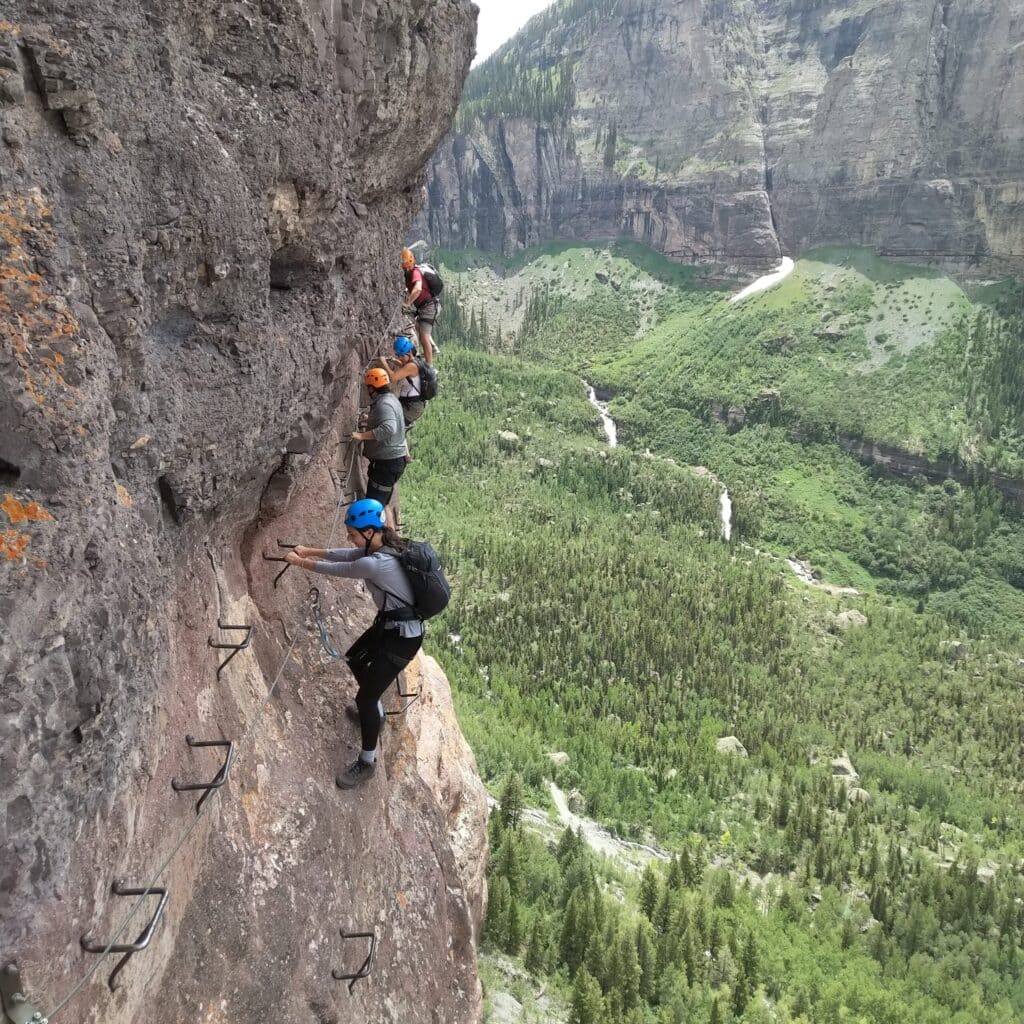 Corina Lambraia scaling a mountain