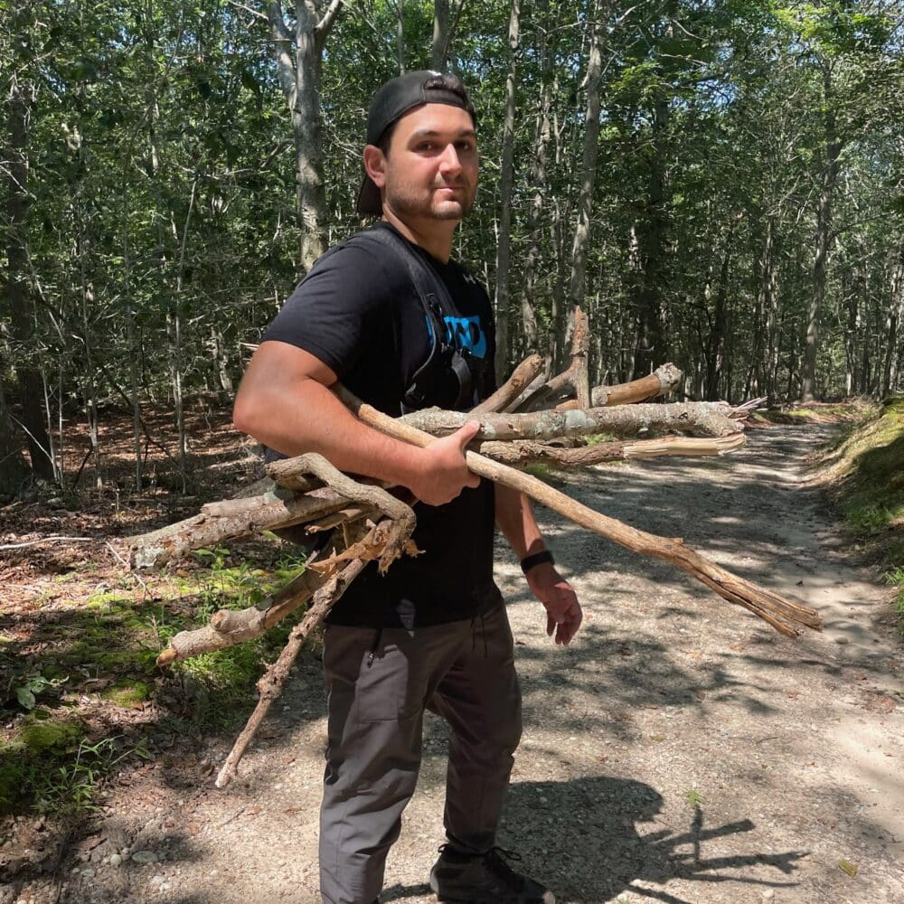 Dylan Pearce collecting sticks