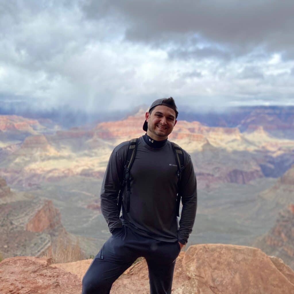 Dylan Pearce hiking on a mountain