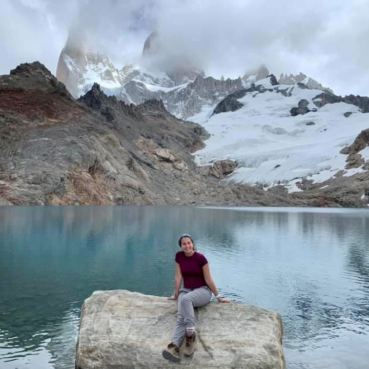 Elana Levine sitting in front of a mountain