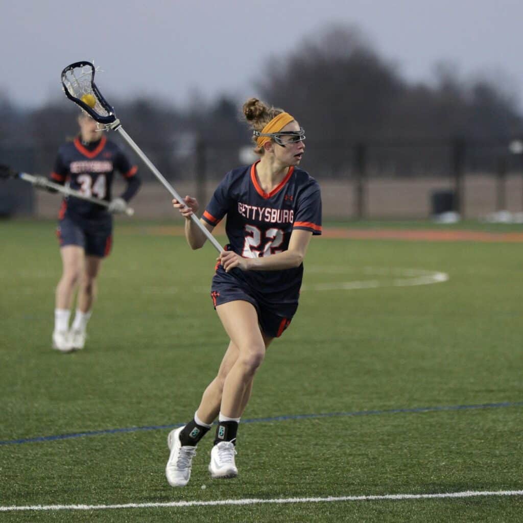 Emily Troy playing lacrosse