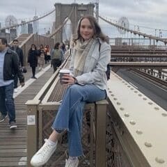 Gabriela Majcher sitting on bridge