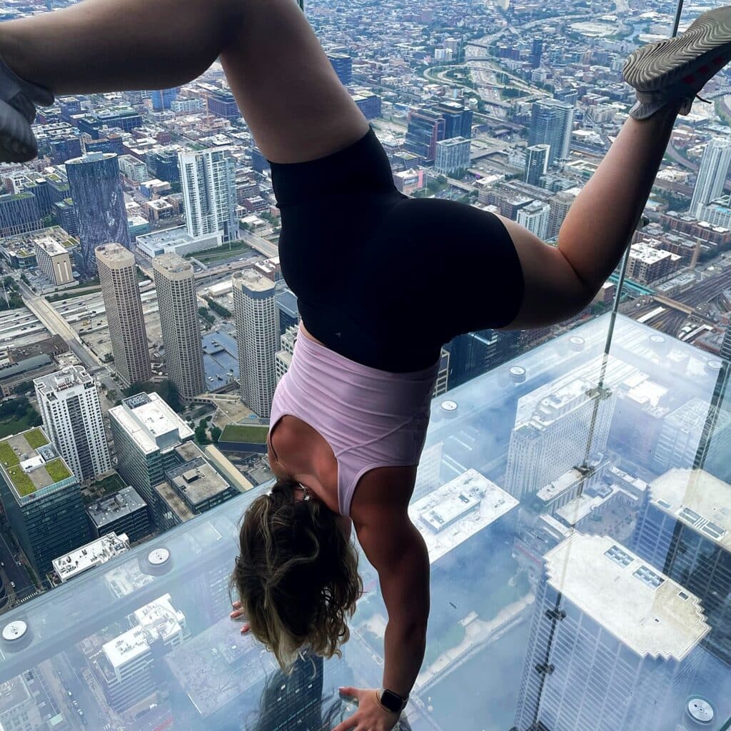 Gabrielle Skolnik handstand on the side of a building