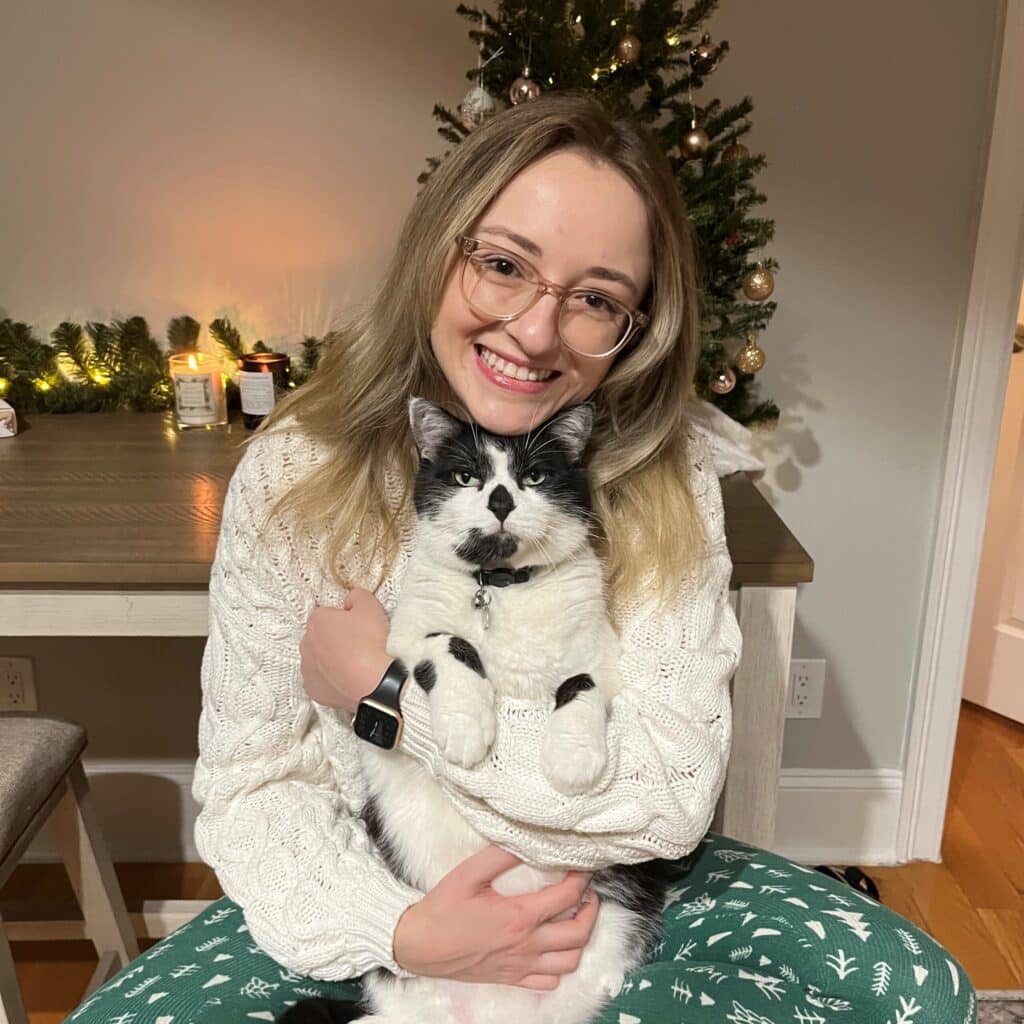 Georgina Genovese hugging her cat