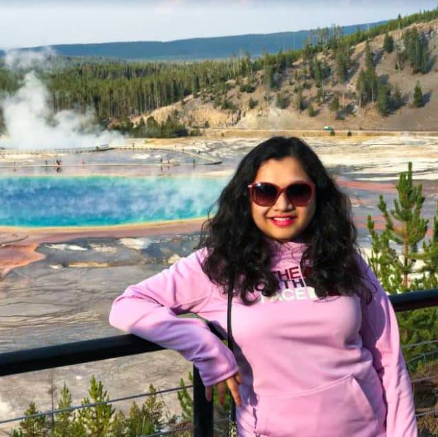 Akshaya Savant in front of Geyser in Yellowstone national park