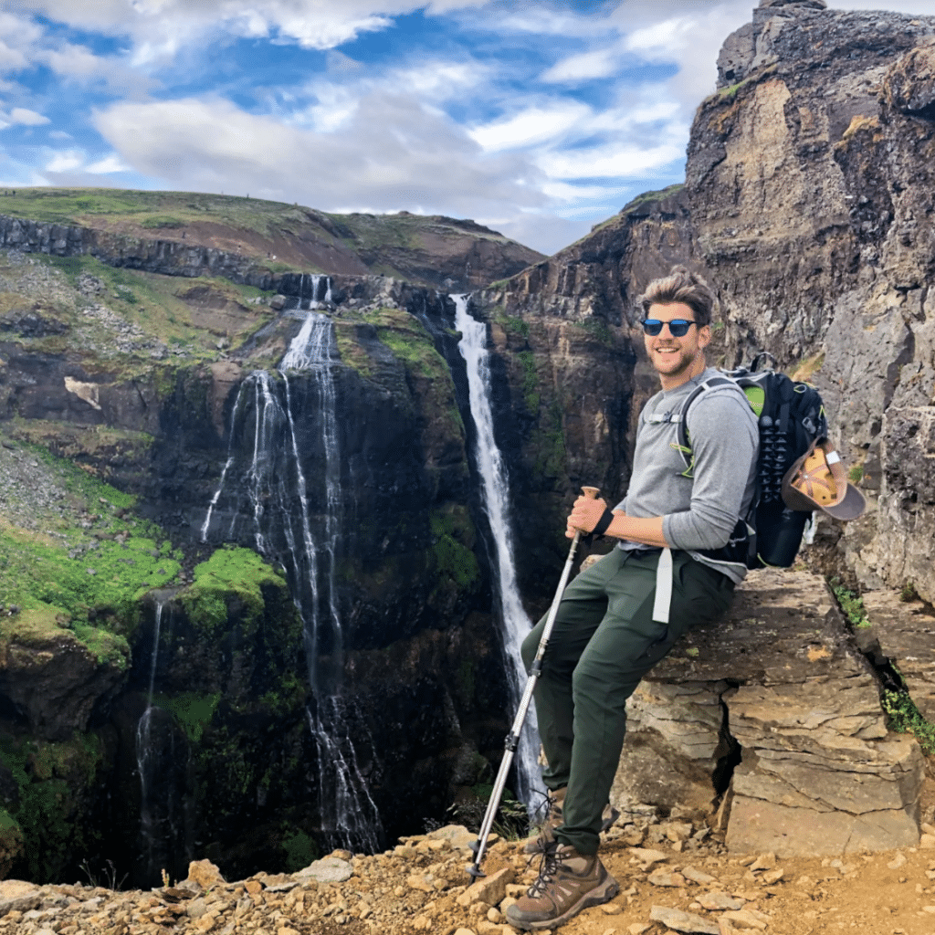 Paul Glushakov in front of waterfall