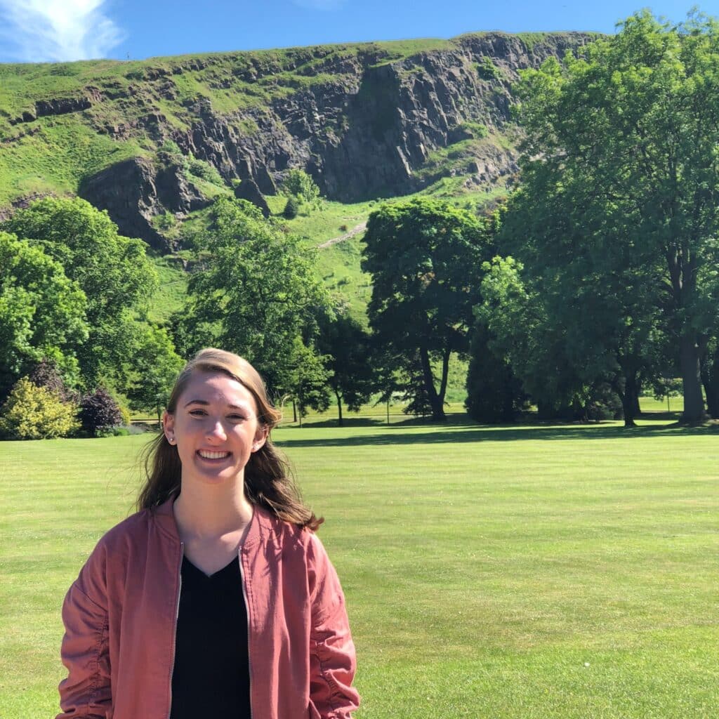 Jenna Evans with a large mountain in the backround