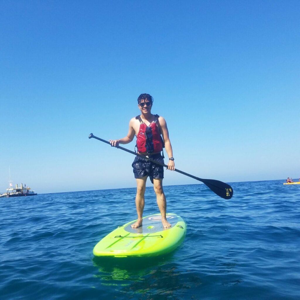 Jericho Mikhail Onglengco paddleboarding