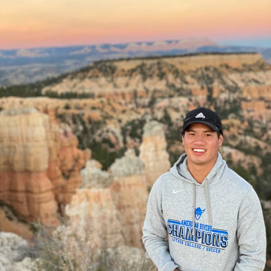 Justin Hoang on top of a mountain