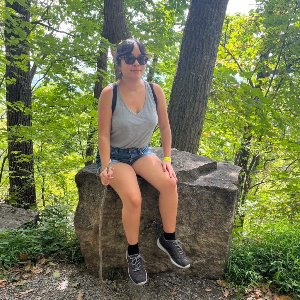 Kathleen Siano sitting on a rock