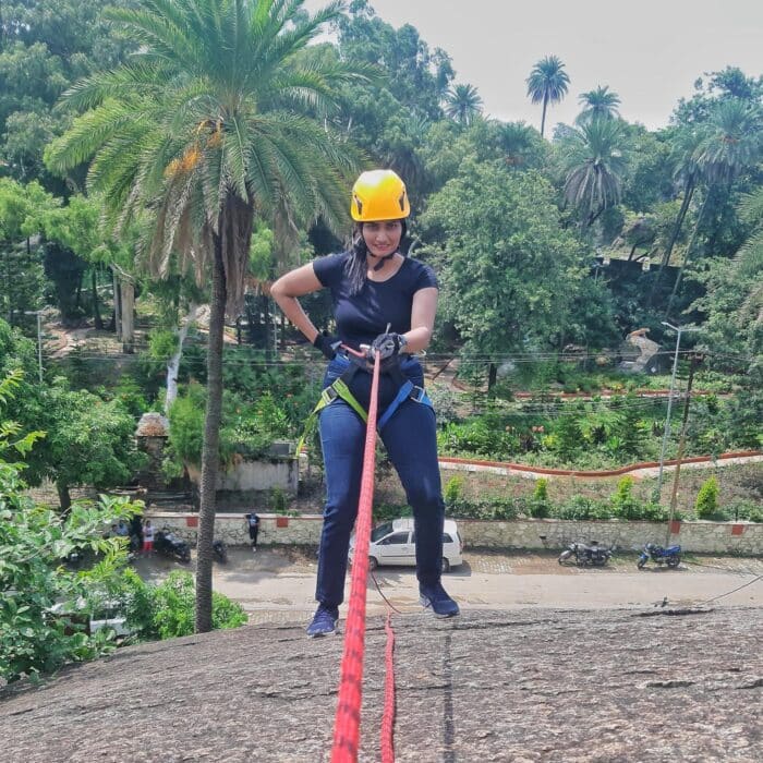 Khyati Kyada scaling a rock