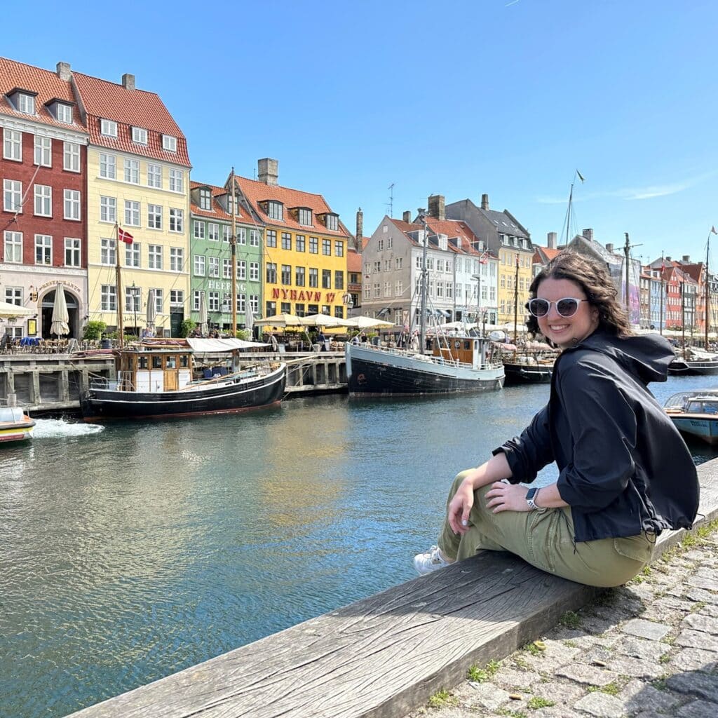 Madison Witt sitting on pier