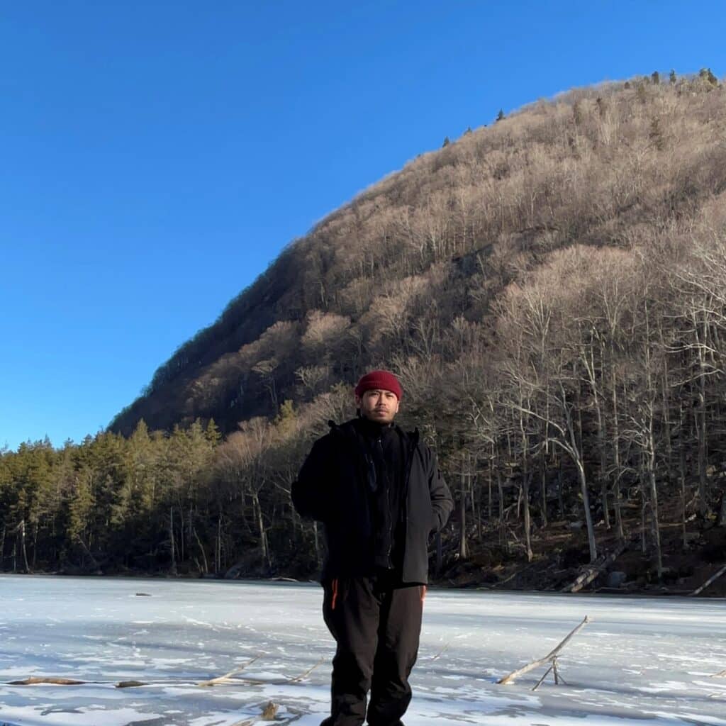 Matthew Tingson in front of a mountain