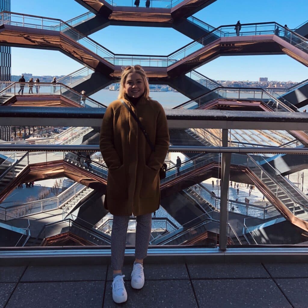 Melanie Renda standing on a cool staircase