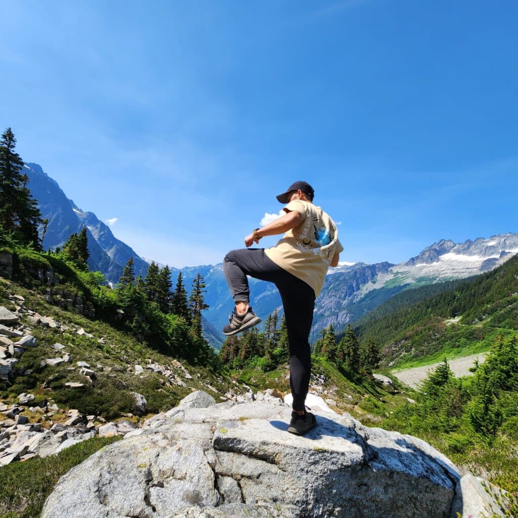 Tony ng doing karate on a rock