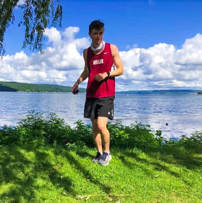 Kyle Davis in front of lake in summer