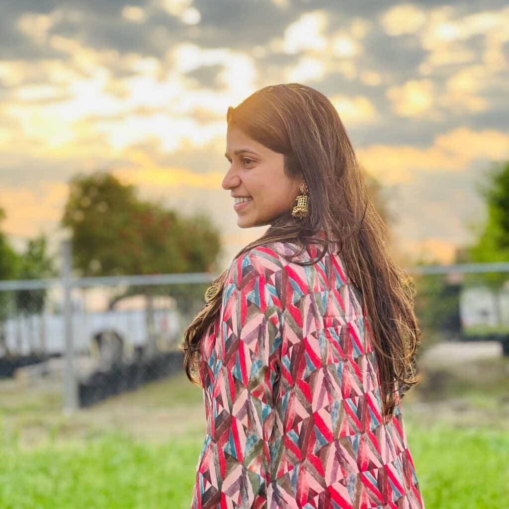 Pooja Shah standing in a field