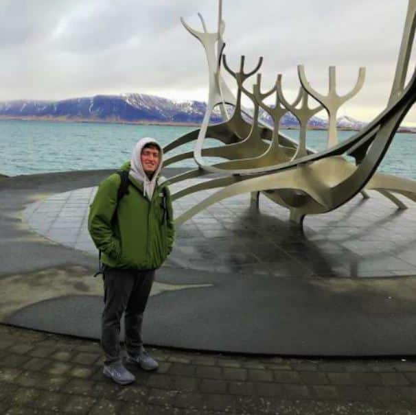 Kieran Morrissey in front of viking boat statue