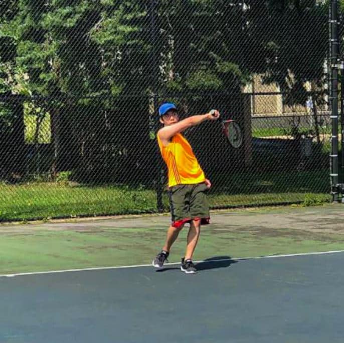 Wilfred Cheung playing tennis