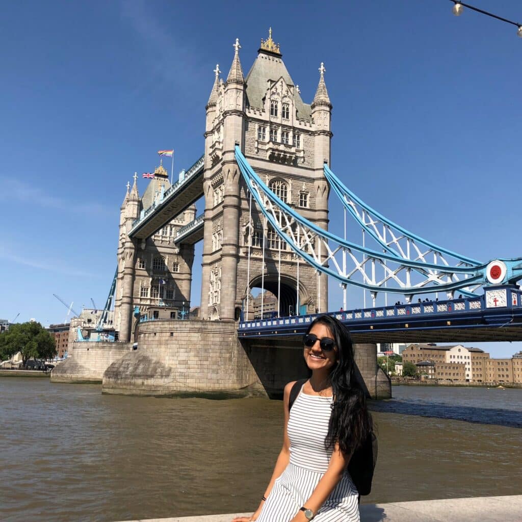 Trisha Sheth in front of a bridge