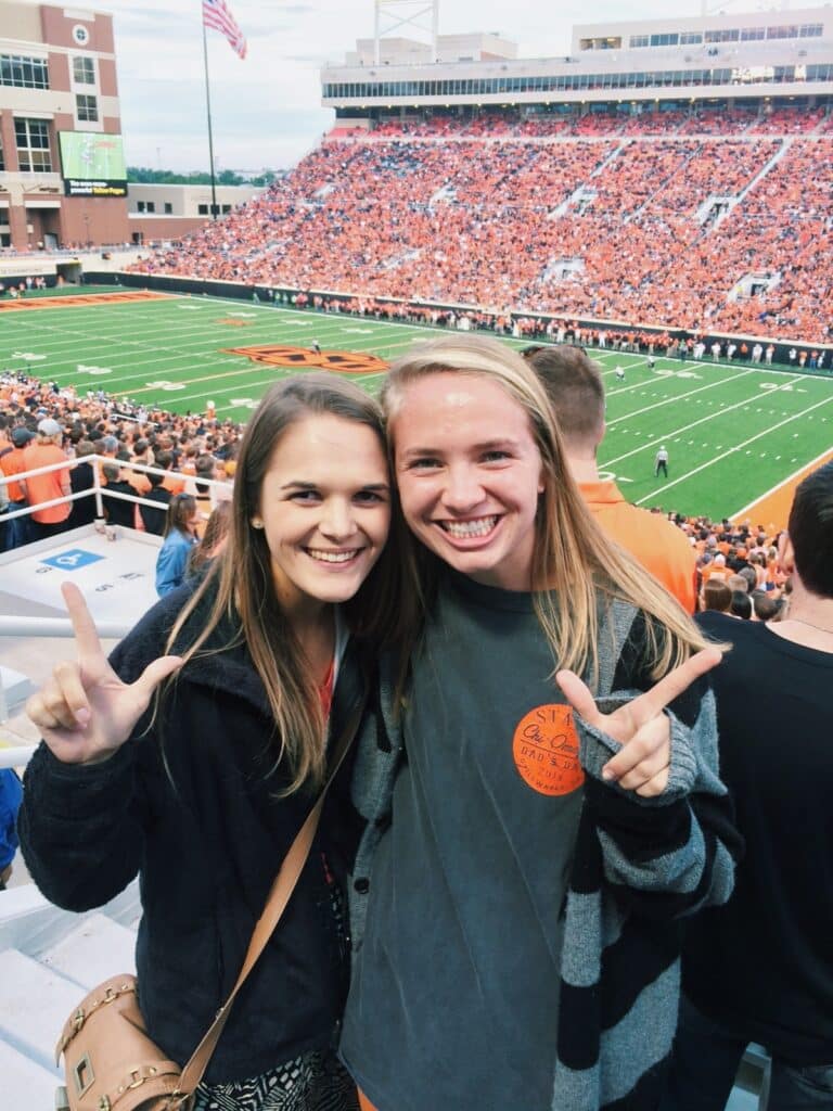 Mary Frances Roebuck with friend during football game