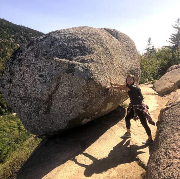 Kendra Barlotta pushing a gigantic rock