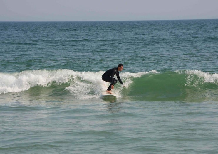 Timothy Caputo surfing