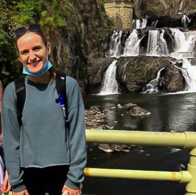 Laura Moran in front of waterfall