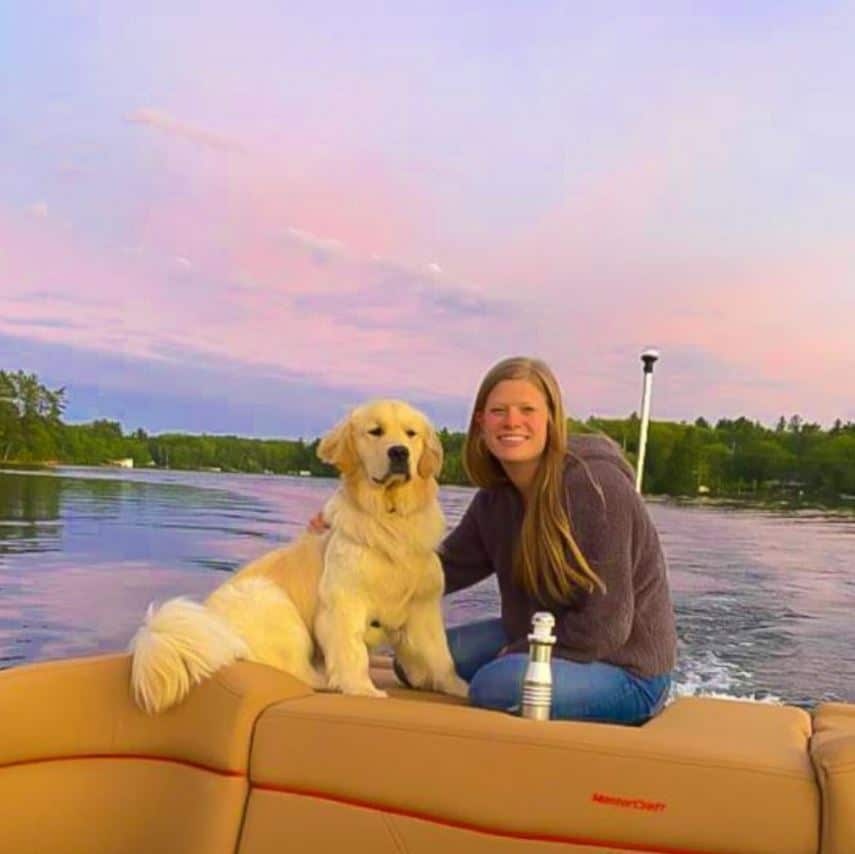 Jennifer Baudhuin with dog on boat