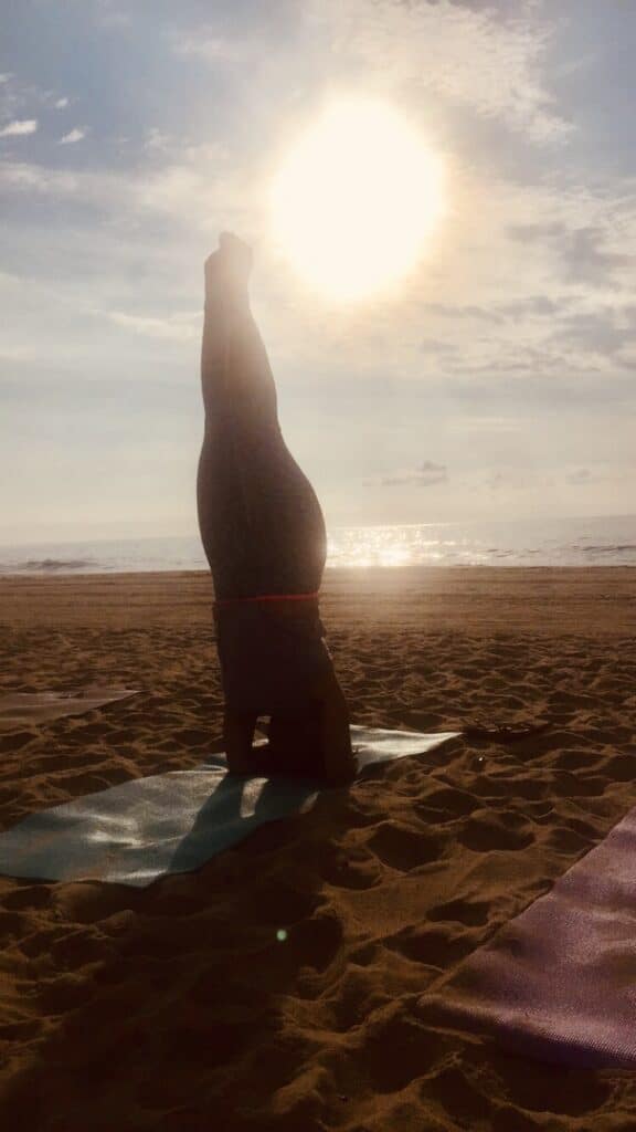 Marivi Lao headstand on beach