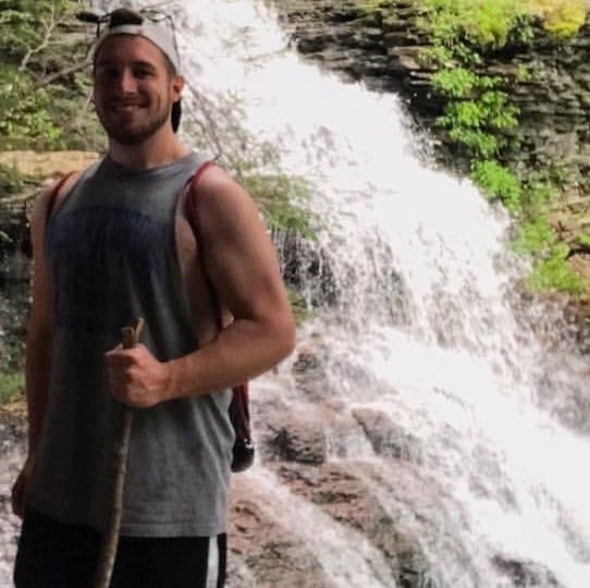 Jeffrey Smith in front of waterfall