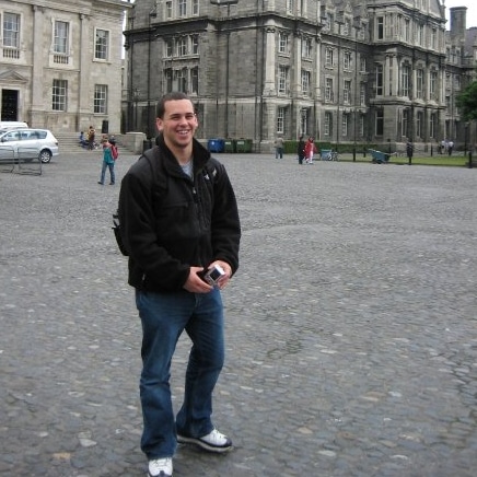 Joe Costello in front of building