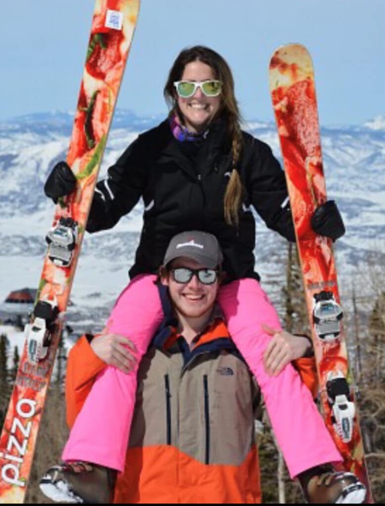 Ryan Grunseich with friend on shoulders skiing