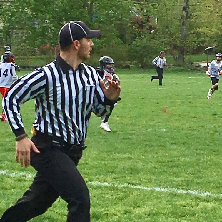 Kyle Stupi refereeing a lacrosse game