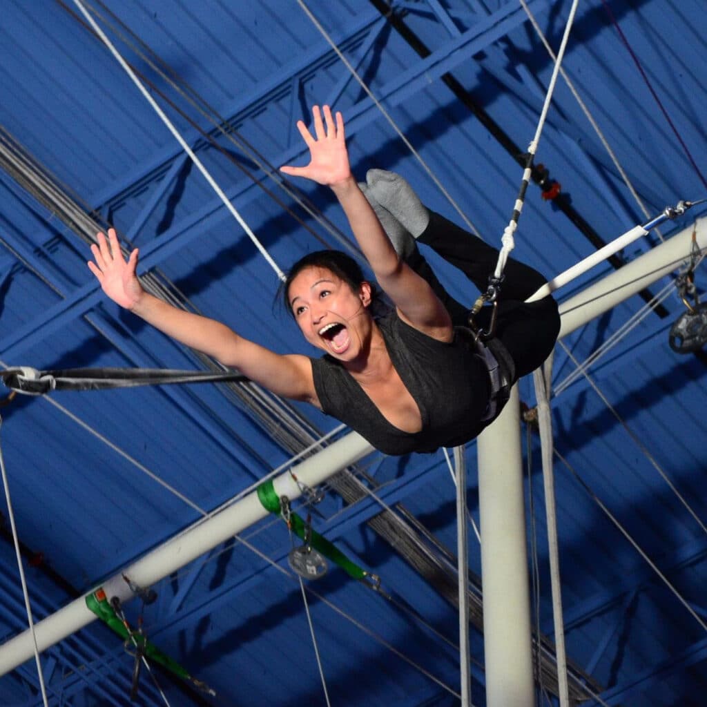 Ninia Agustin on large circus swing