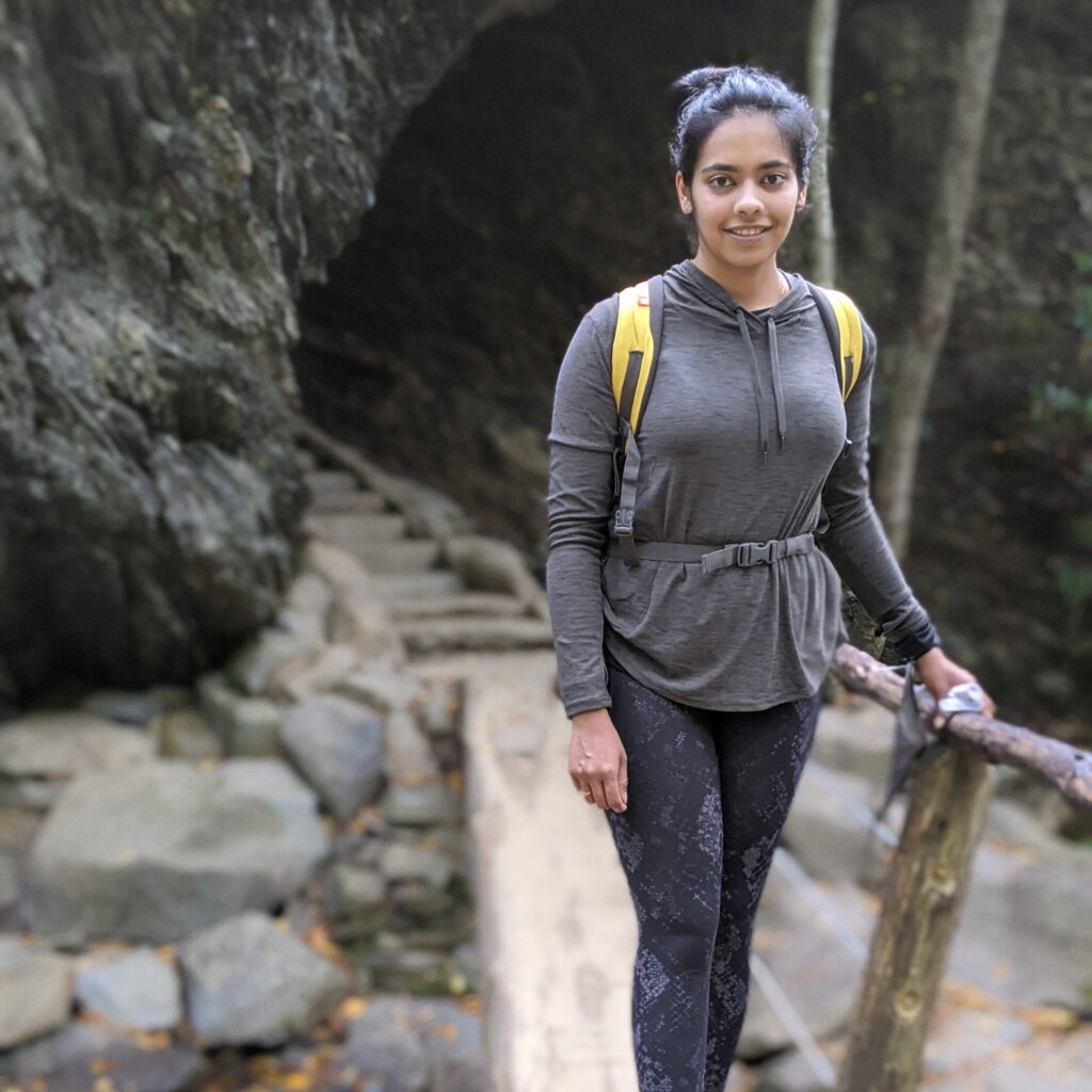 Aakanksha Bhagwat hiking picture in front of tunnel