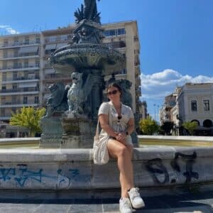 Alyssa Kopsidas on a fountain