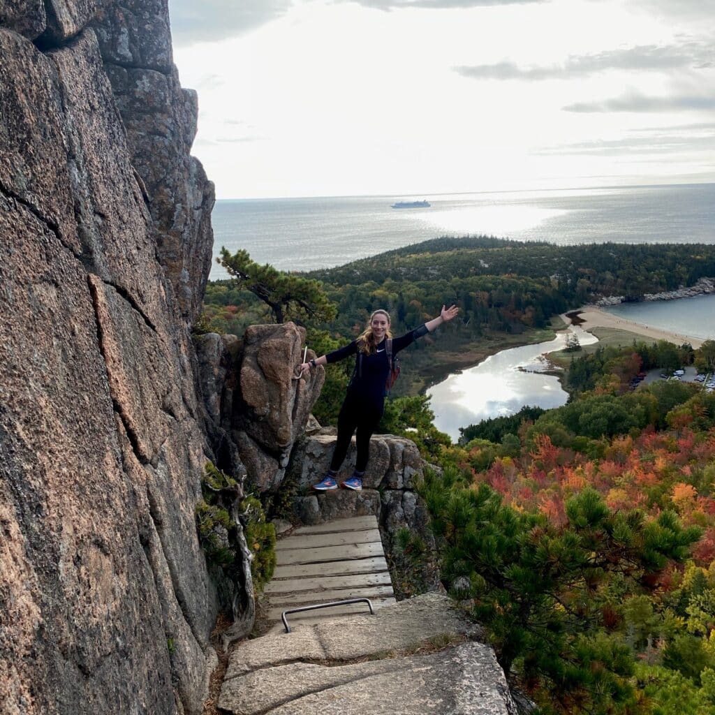 Amanda Fleres hiking a mountain