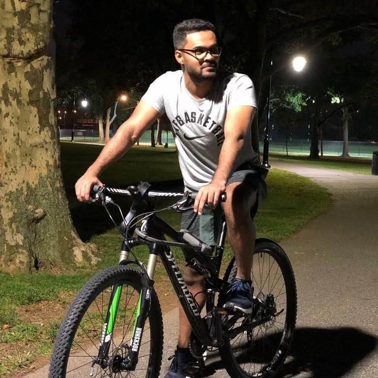 Anant Kulkarni riding a bike at night