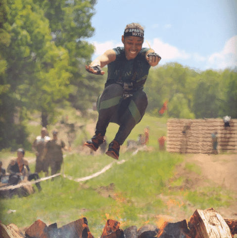 Anika Rivera jumping over fire