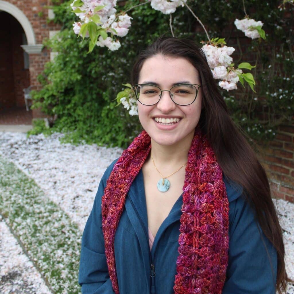 Audrey Reyes portrait in front of flowers