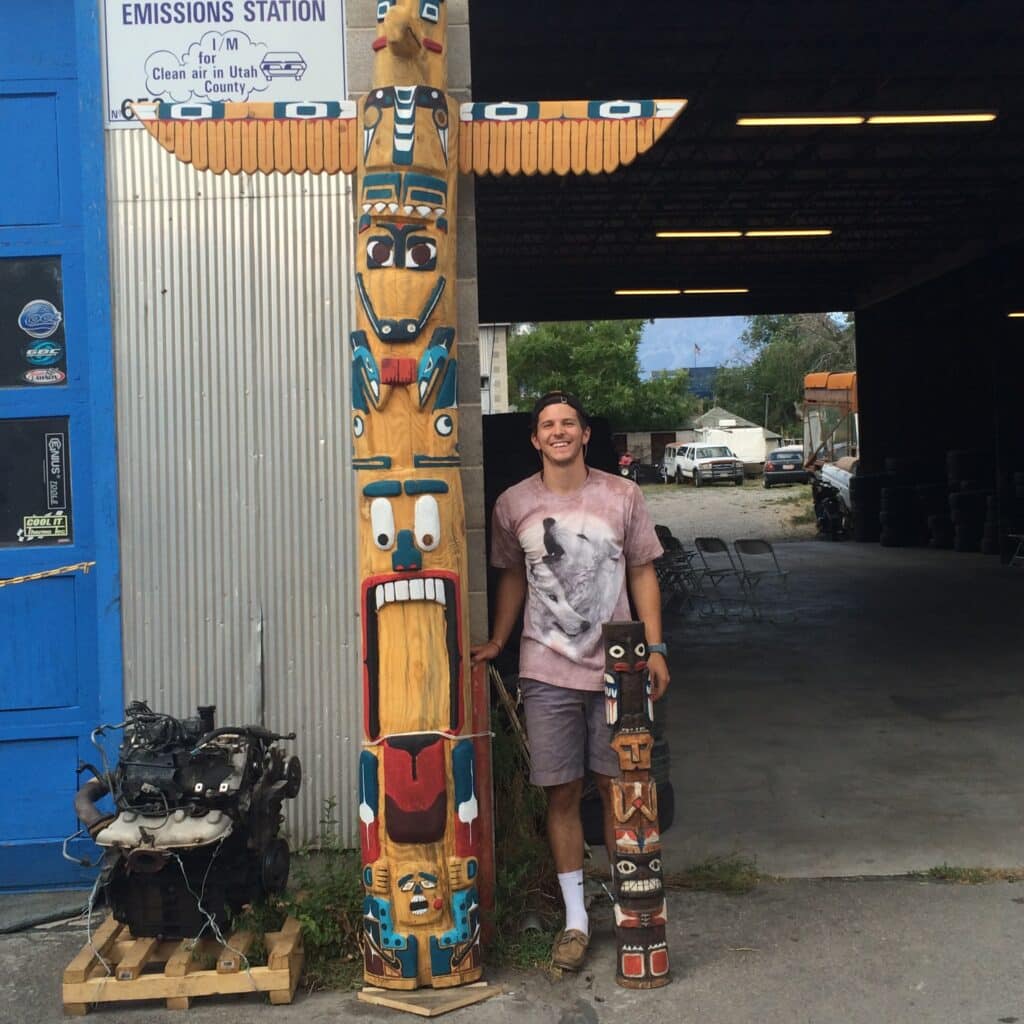 Ben Miles next to totem pole