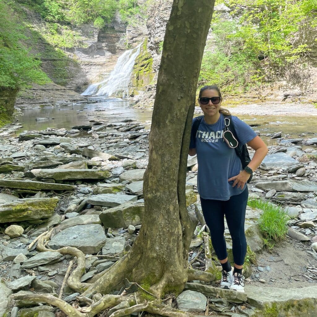 Camryn Gessner in front of waterfall