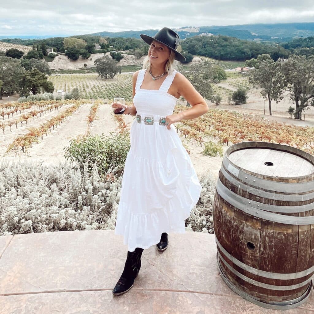 Claire Ruth at a farm in a dress